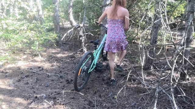 Found cute tattoed girl riding bicycle in the forest and fucking her hairy pussy